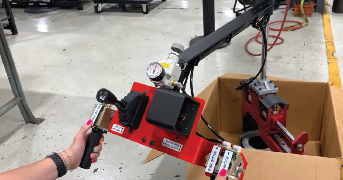 machine tending lift assist arm handling 50 pound part